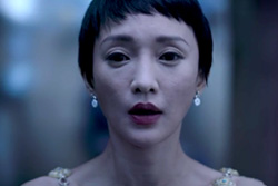 [asian woman with short black hair, pale skin, and red lips, slightly parted, stares to cameera]